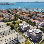 Wing 77 By Belmont Realty